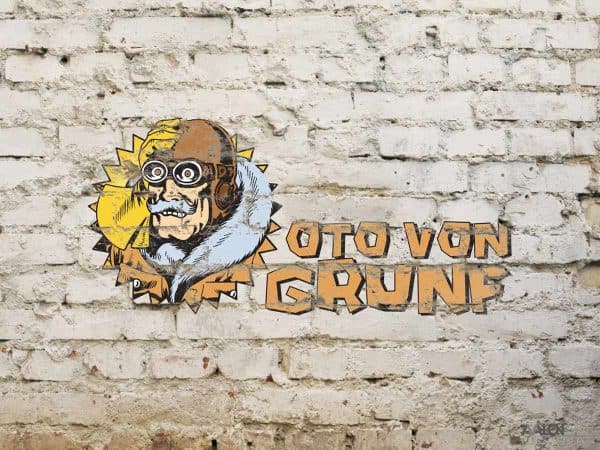 Илустрација лика са наочарима и натпис „OTTO VON GRUNE“ на зиду